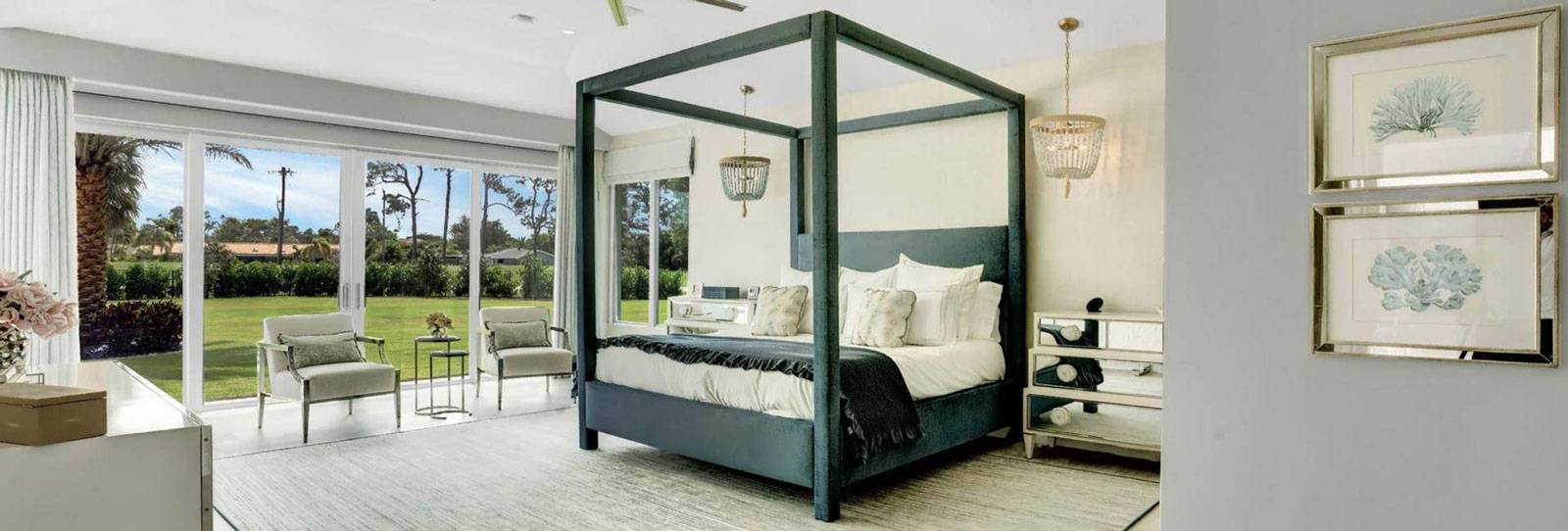 Home Construction with a new master bedroom with a black bedframe in Delray Beach