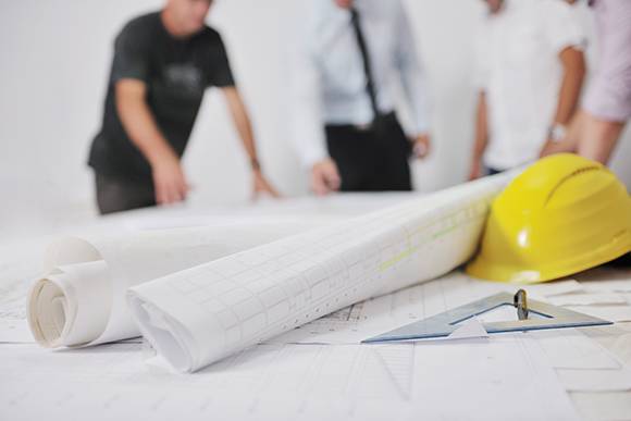 Construction Estimator in Boca Raton reviewing blueprints