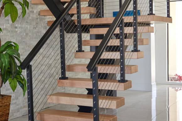 modern steel and wood stairs installed after Design-Build Home Construction for Palm Beach Gardens, Florida