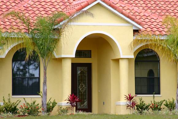 Boynton Beach, FL Home Exterior Following Stucco Services by Local Stucco Contractor