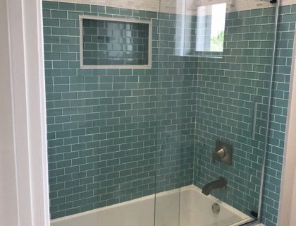 Bath remodel in Boynton Beach with green subway tiles