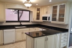 Kitchen remodel in Boynton Beach with dark countertops