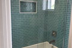 Bath remodel in Boynton Beach with green subway tiles